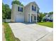 Charming two-story home with a well-manicured lawn and attached garage plus an extended driveway at 7311 Fig Ln, Charlotte, NC 28215