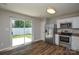 Well-lit kitchen includes modern appliances and sliding doors to the backyard at 7311 Fig Ln, Charlotte, NC 28215