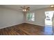Bright living room showcases modern flooring and natural light through the window at 7311 Fig Ln, Charlotte, NC 28215