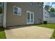 Home's backyard featuring a concrete patio at 7711 Brisbane Ct, Charlotte, NC 28215