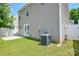 Backyard view of home showing patio, vinyl fence, and HVAC system at 7711 Brisbane Ct, Charlotte, NC 28215