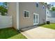 The backyard features a concrete patio and vinyl privacy fence at 7711 Brisbane Ct, Charlotte, NC 28215