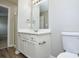 Functional bathroom with vanity, mirror, lighting, and tiled shower at 7711 Brisbane Ct, Charlotte, NC 28215