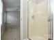 Bathroom with tiled shower and view of the bedroom at 7711 Brisbane Ct, Charlotte, NC 28215