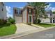 Well-maintained two-story home with an attached garage and traditional curb appeal at 7711 Brisbane Ct, Charlotte, NC 28215