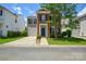 Charming two-story home featuring a brick facade, attached garage, and well-maintained lawn at 7711 Brisbane Ct, Charlotte, NC 28215