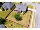 Aerial view of a fenced backyard, featuring a well-kept lawn and mature trees at 786 Sw Treva Anne Sw Dr, Concord, NC 28027