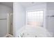 Bright bathroom with a jetted tub and shower at 786 Sw Treva Anne Sw Dr, Concord, NC 28027