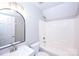 Full bathroom features tub, shower, white sink and vanity, as well as tile flooring at 786 Sw Treva Anne Sw Dr, Concord, NC 28027