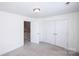 Neutral carpet in a bedroom with closet, trim, and doorway at 786 Sw Treva Anne Sw Dr, Concord, NC 28027
