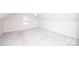 Spacious bedroom with neutral carpet, natural light, and attic style ceiling at 786 Sw Treva Anne Sw Dr, Concord, NC 28027