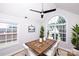 Dining room with wood table, white chairs, and a large window with natural light at 786 Sw Treva Anne Sw Dr, Concord, NC 28027