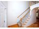 Bright entryway featuring hardwood floors, a staircase, and neutral decor at 786 Sw Treva Anne Sw Dr, Concord, NC 28027