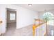 Upstairs hallway leading to a bedroom, natural light from the window at 786 Sw Treva Anne Sw Dr, Concord, NC 28027