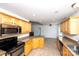 Well-lit kitchen boasting granite countertops and stainless steel appliances at 786 Sw Treva Anne Sw Dr, Concord, NC 28027