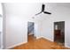 Open-concept living room with hardwood floors and access to other rooms at 786 Sw Treva Anne Sw Dr, Concord, NC 28027