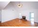 Cozy living room featuring wood flooring, high ceilings and a brick fireplace at 786 Sw Treva Anne Sw Dr, Concord, NC 28027