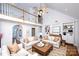 Inviting living room with high ceilings, built-in shelving, and stylish furniture at 786 Sw Treva Anne Sw Dr, Concord, NC 28027
