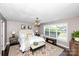 Serene main bedroom featuring neutral tones, large windows and a ceiling fan at 786 Sw Treva Anne Sw Dr, Concord, NC 28027