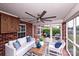 Relax on the patio with brick accent wall, ceiling fan, and elegant furniture at 786 Sw Treva Anne Sw Dr, Concord, NC 28027