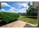 Lush backyard featuring a well-manicured lawn, mature trees, and a patio, creating an inviting outdoor space for leisure at 786 Treva Anne Sw Dr, Concord, NC 28027