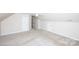 This is a bedroom with light-colored carpet, white walls and trim, and a standard door and storage space at 786 Treva Anne Sw Dr, Concord, NC 28027