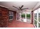Enclosed porch with a large ceiling fan offers a relaxing outdoor space, blending indoor comfort with the beauty of the outdoors at 786 Treva Anne Sw Dr, Concord, NC 28027