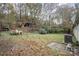 A view of the secluded backyard surrounded by lush mature trees for privacy and shade at 811 Acclaim Dr, York, SC 29745