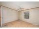 A bright unfinished bedroom with ceiling fan and a double window, great for customization at 811 Acclaim Dr, York, SC 29745