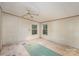 An unfinished bedroom with a ceiling fan and double window provides an opportunity to customize to your liking at 811 Acclaim Dr, York, SC 29745
