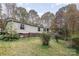 Charming single-story home surrounded by trees; features neutral siding and a cozy, inviting facade at 811 Acclaim Dr, York, SC 29745
