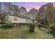 Charming single-story home surrounded by trees; features neutral siding and a cozy, inviting facade at 811 Acclaim Dr, York, SC 29745