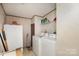 This laundry room features both a washing machine and a dryer, plus additional storage at 811 Acclaim Dr, York, SC 29745