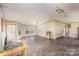 Open-concept living area with wood-look floors, ample natural light, and neutral walls creating a bright space at 811 Acclaim Dr, York, SC 29745