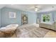 Expansive bedroom featuring light blue walls, large windows, and plush furnishings for a serene retreat at 8534 Highgrove St, Charlotte, NC 28277
