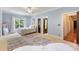 Bright bedroom featuring light blue walls, a large window and ensuite bathroom at 8534 Highgrove St, Charlotte, NC 28277