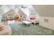 Spacious bonus room with carpet and hardwood, dormer windows, and multiple ceiling fans at 8534 Highgrove St, Charlotte, NC 28277