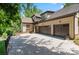 Spacious home featuring a brick driveway and a three car garage at 8534 Highgrove St, Charlotte, NC 28277