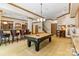 Billiards table and bar area in a finished basement rec room with carpet and neutral decor at 8534 Highgrove St, Charlotte, NC 28277