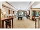 Large game room with billiards table, kitchenette, bar area, and windows at 8534 Highgrove St, Charlotte, NC 28277