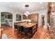 Spacious kitchen featuring a large island with seating and modern stainless steel appliances at 8534 Highgrove St, Charlotte, NC 28277