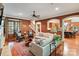 Open living room with hardwood floors, comfortable furniture, and an open view to the kitchen and staircase at 8534 Highgrove St, Charlotte, NC 28277
