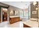 Luxurious main bathroom with marble floors, a soaking tub, and a dual vanity at 8534 Highgrove St, Charlotte, NC 28277