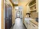 Elegant mudroom with custom cabinets, farmhouse sink, and convenient access to the home's entrance at 8534 Highgrove St, Charlotte, NC 28277