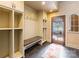 Well-designed mudroom with built-in bench, storage cubbies, and coat hooks for organization at 8534 Highgrove St, Charlotte, NC 28277