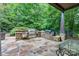 Outdoor kitchen featuring stone countertops, stainless steel grill, and a stone patio at 8534 Highgrove St, Charlotte, NC 28277