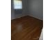 Bedroom with hardwood floors, natural light, and ample space for furniture at 947 Ravendale Dr, Charlotte, NC 28216
