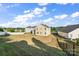Spacious backyard featuring a mix of grass and dirt with fencing at 9533 Silverdale Ln, Charlotte, NC 28269