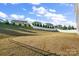 Spacious backyard featuring a mix of grass and dirt with a privacy fence at 9533 Silverdale Ln, Charlotte, NC 28269