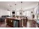 Bright eat-in kitchen with granite counters, stainless steel appliances and large island open to the living area at 9533 Silverdale Ln, Charlotte, NC 28269
